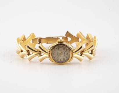 IDEX
Ladies' wristwatch in yellow gold (750).

Round...