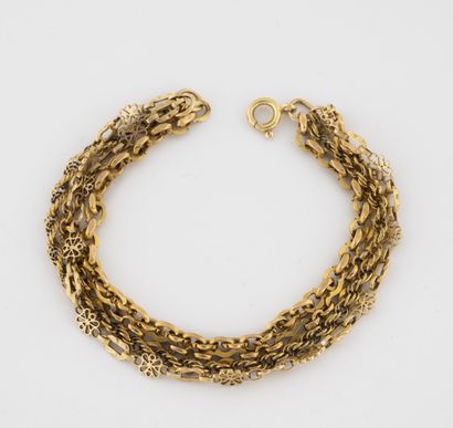 Yellow gold bracelet (750) with four rows....