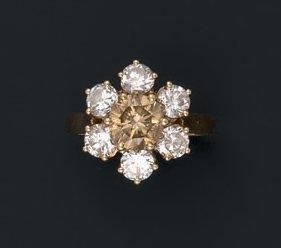 Bague en or jaune griffée d'un diamant de...