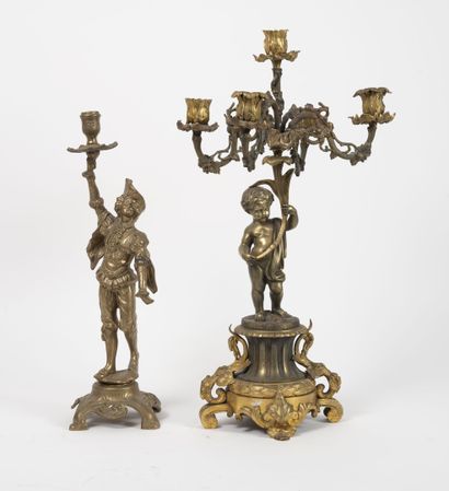 Two bronze candelabras on quadripod bases....