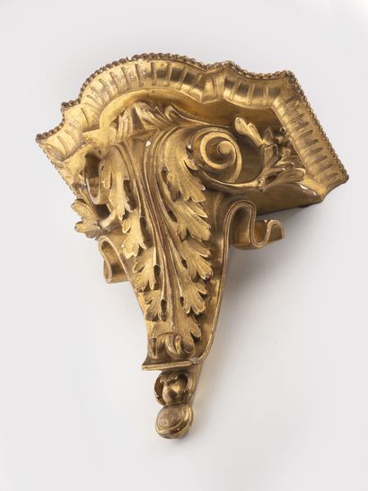 A small molded plaster and gilded console...