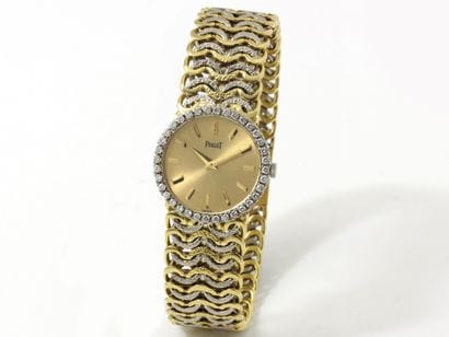 PIAGET
Lady's wristwatch in 2 shades of gold...