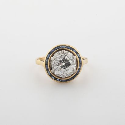 Gold (750) and platinum (850) ring, set with...