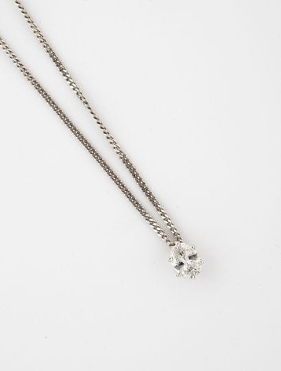 White gold (750) necklace holding a pendant...