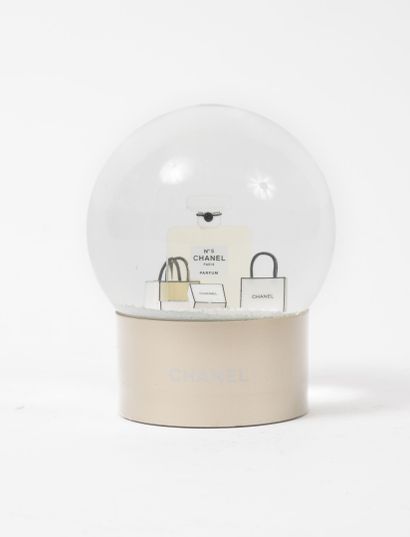 CHANEL
Snow globe paper press with a design...