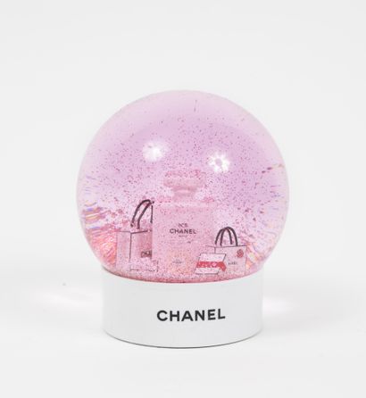 CHANEL
Pink snowball with two bottles of...