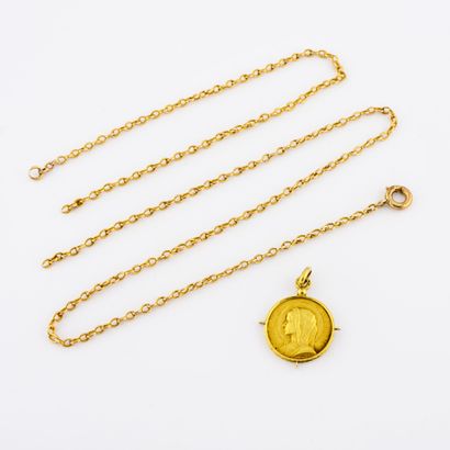 Religious pendant in yellow gold (750).

Weight...