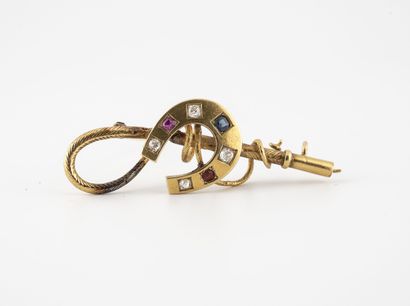 Yellow gold (750) horseshoe brooch with a...