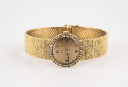 UTI
Montre bracelet de dame en or jaune (750).

Boîtier...