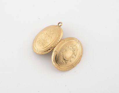 Pendentif porte-photo en or jaune (750).

Poids...