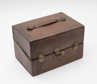 G. KELLER
Brown leather travel case containing...