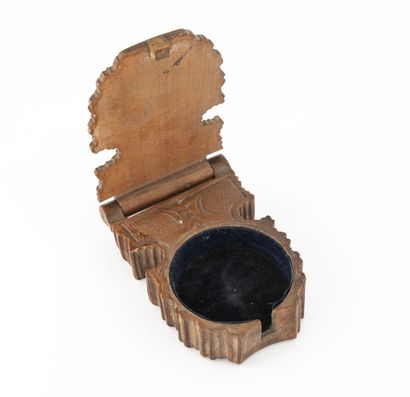 Small carved wood watch case decorated with...