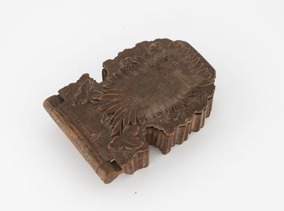 Small carved wood watch case decorated with...