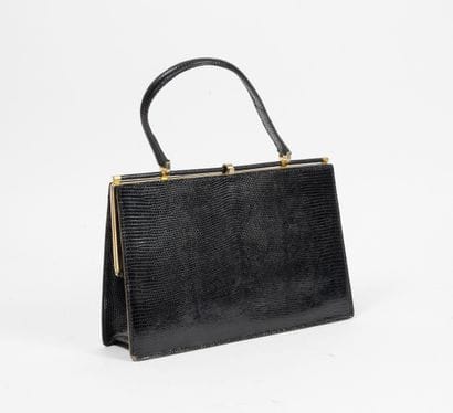 Black leather bag lizard style. 

With golden...