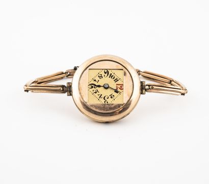 Lady's wrist watch in gold metal.

Round...