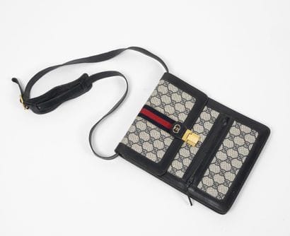GUCCI
Supreme GG canvas and navy blue leather...