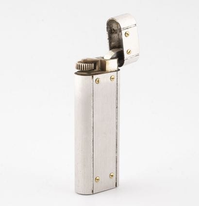 CARTIER, Santos
Metal pocket lighter.

Signed...