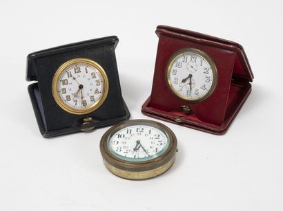 Set of three gilt metal travel alarm clocks....
