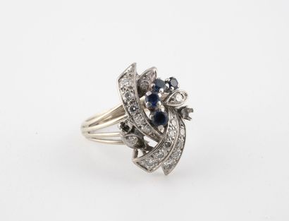 Rhodium-plated yellow gold ring centered...