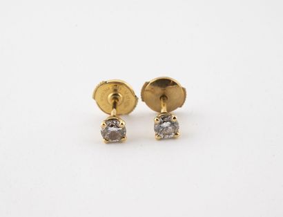 Pair of yellow gold (750) earrings set with...