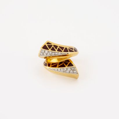 A large yellow gold (750) ring with two red...