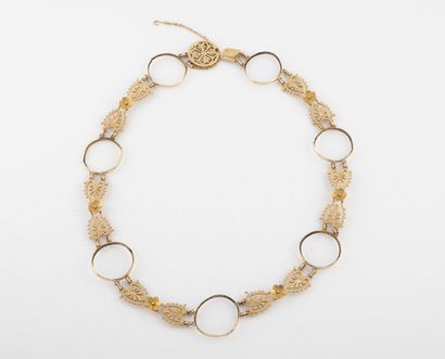 Yellow gold necklace (750) formed of stylized...