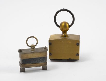 Two hanging magnets, one with magnet stone,...