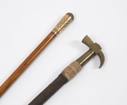 Rider's whip sheathed in black braid, with...