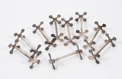 SAINT-MEDARD
Set of 9 silver plated cruciform...