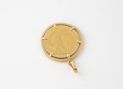 Pendentif en or jaune (750) retenant en serti...