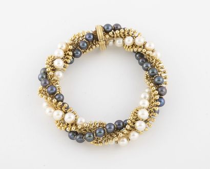 Bracelet torsade en or jaune (750) à deux...