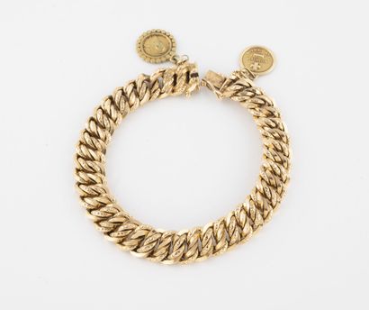 Bracelet en or jaune (750) à maille américaine...