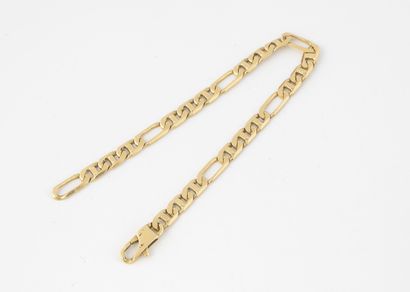 Bracelet en or jaune (750) à mailles alternées...