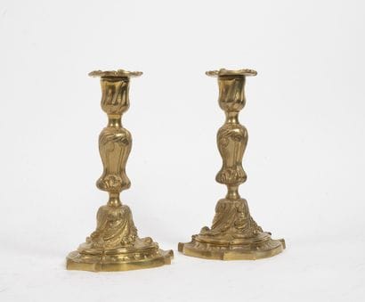 Pair of bronze torches in rocaille style...