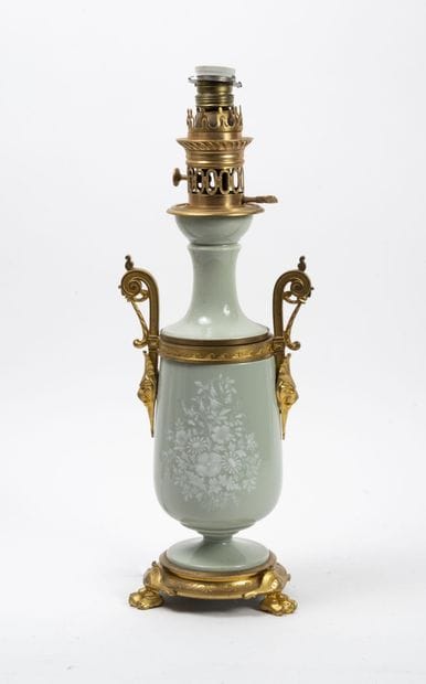 Kerosene lamp base formed by a vase on pedestal...