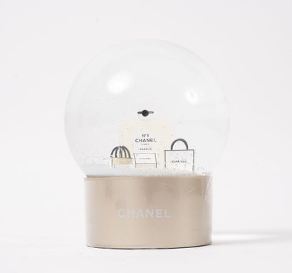 CHANEL
Snow globe with a bottle of Chanel...