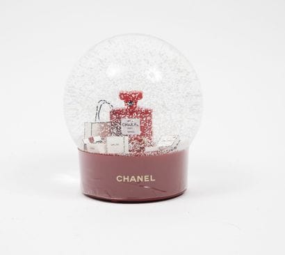 CHANEL PARIS
Motorized snow globe decorated...