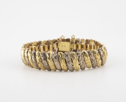 Bracelet articulé en ors jaune et gris (750)...