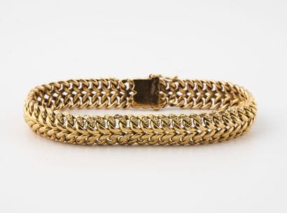 Small ribbon bracelet in yellow gold (750)...