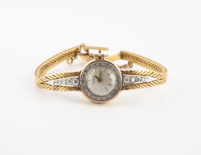 TISSOT
Lady's wristwatch in yellow gold (750).

Round...