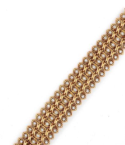 Bracelet souple en or jaune (750) et platine...
