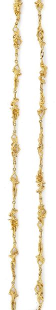 Etonnant collier sautoir en or jaune (750),...