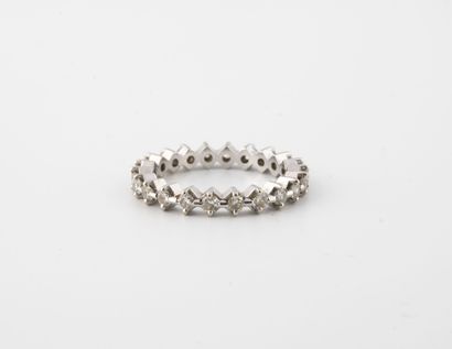 Small American wedding band in white gold...