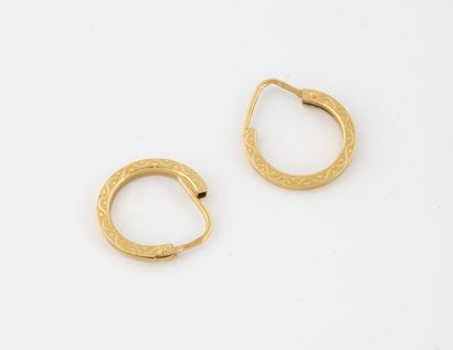 Pair of creoles in yellow gold (750) with...