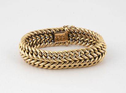 Bracelet gourmette en or jaune (750).

Fermoir...