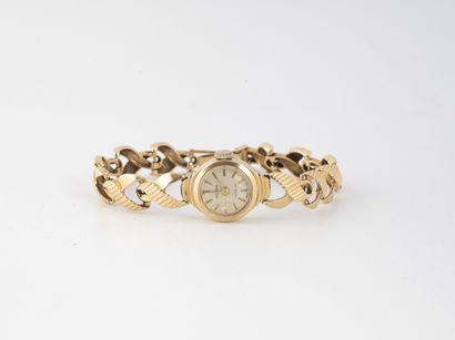 EVIANA
Yellow gold (750) ladies' wristwatch.

Round...