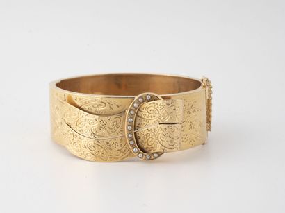 Rigid opening bracelet in yellow gold (750)...