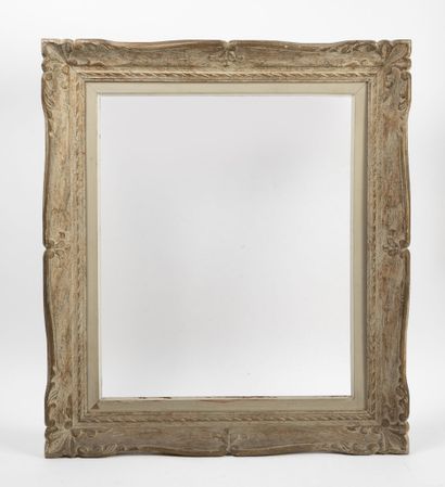 Carved and patinated wood frame.

Foliage...