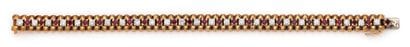 Bracelet articulé en ors jaune et gris (750)...