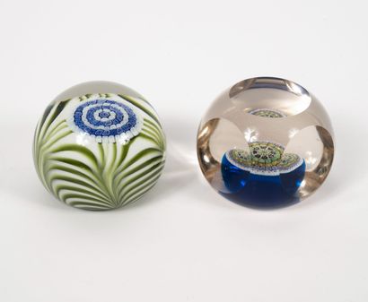 MURANO
Two paperweight balls in colorless...